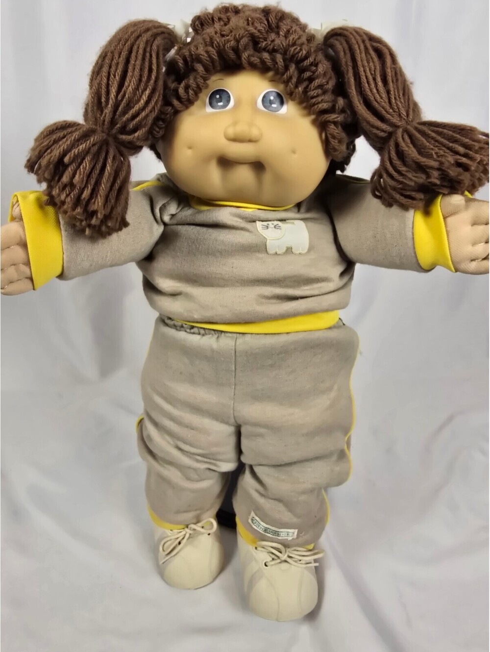 Vintage 1982 Cabbage Patch Kids Doll with Brown Yarn Hair and Yellow-Trimmed Paj